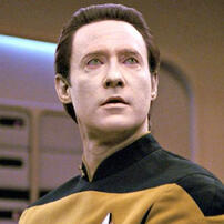 A still image taken from an episode of Star Trek: The Next Generation, featuring Data